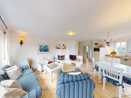 Impression vom Wohnbereich mit Zugang zur Sonnenterrasse im Erdgeschoss