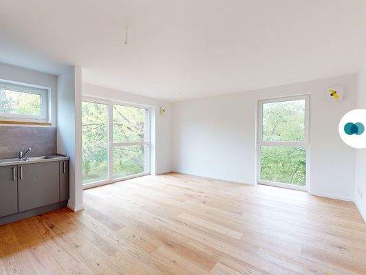 Ansicht I: Wohn- und Esszimmer mit offenem Küchenbereich