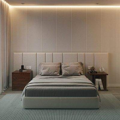Modernes Schlafzimmer mit integrierter Beleuchtung und gepolsterter Akzentwand