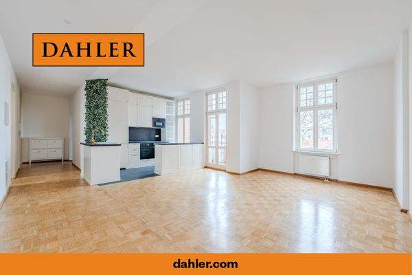 Spacious living room with open-plan kitchen and ba