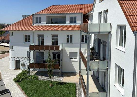 Blick vom Penthouse auf den Bestandsbau