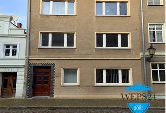 Hausansicht mit Logo