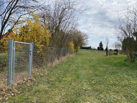 Einfahrt Bauplatz mit verstellbarem Grundstückszaun