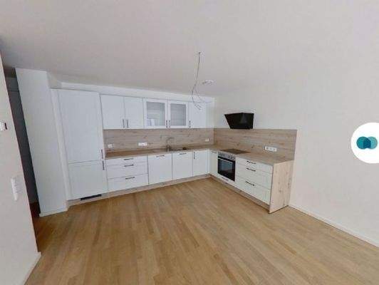 Ansicht III: Wohn- und Esszimmer mit offener Küche