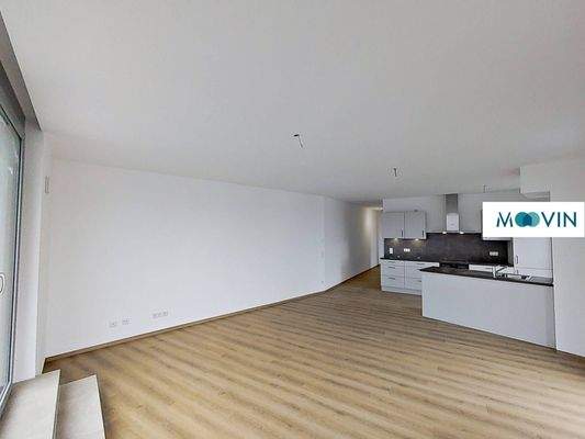 Ansicht IV: Wohn- und Esszimmer mit offenem Küchenbereich