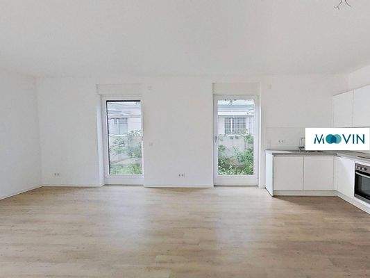 Ansicht II: Wohn- und Esszimmer mit offenem Küchenbereich