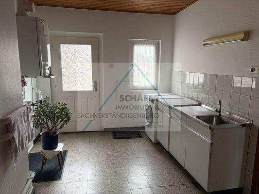 Waschküche mit Terrassenzugang