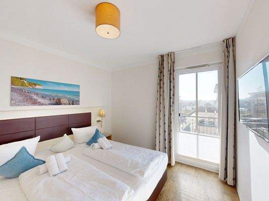 Schlafzimmer mit Balkonzugang