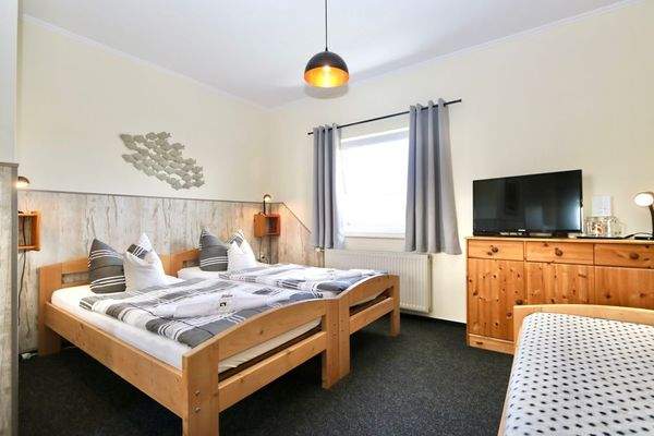 Das großzügige Dreibettzimmer