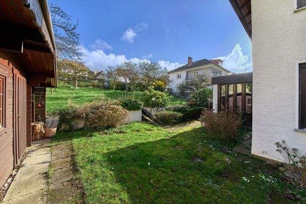 Side view of garden, sauna to the left