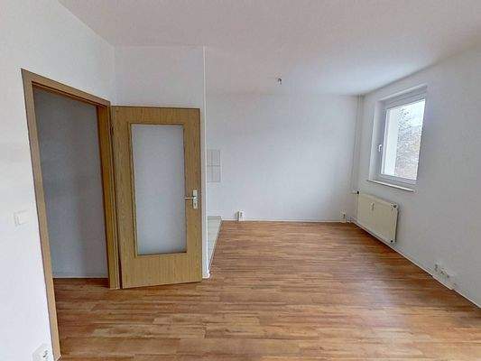 Ansicht IV: Wohn- und Esszimmer mit offenem Küchenbereich