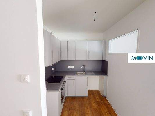 Ansicht III: Wohn- und Schlafzimmer mit offenem Küchenbereich