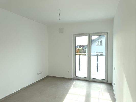 Schlafzimmer mit Zugang zur Dachterrasse