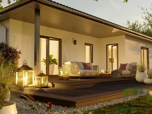 Winkelbungalow 108 Gartenansicht Terrasse abends Sonnenuntergang.png