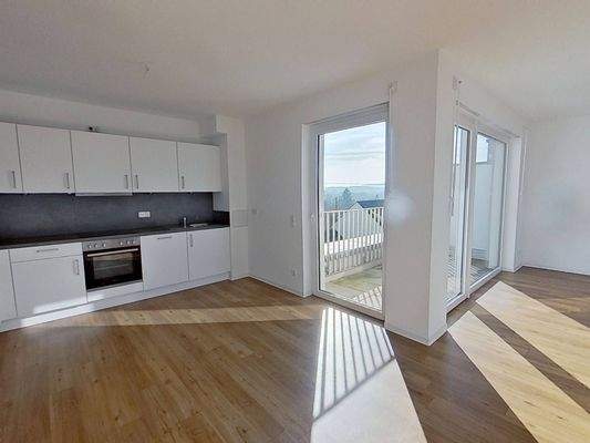 Ansicht V: Wohn- und Esszimmer mit offenem Küchenbereich