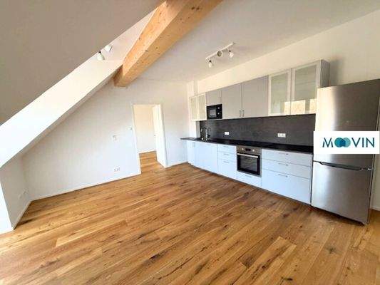 Ansicht II: Wohn- und Esszimmer mit offenem Küchenbereich