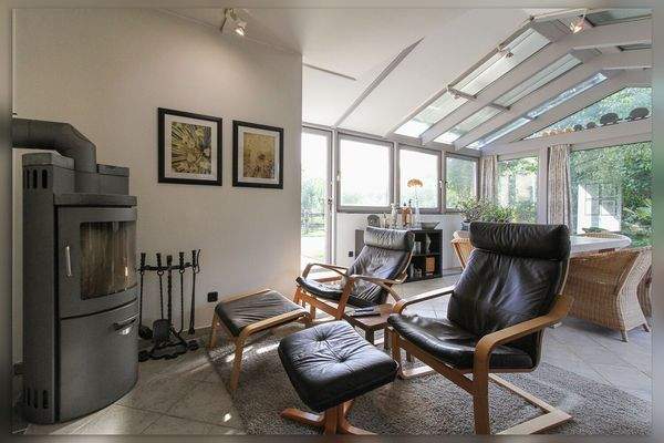 Wintergarten mit Holzofen