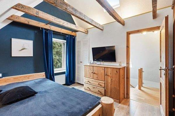 eines der Zimmer im DG