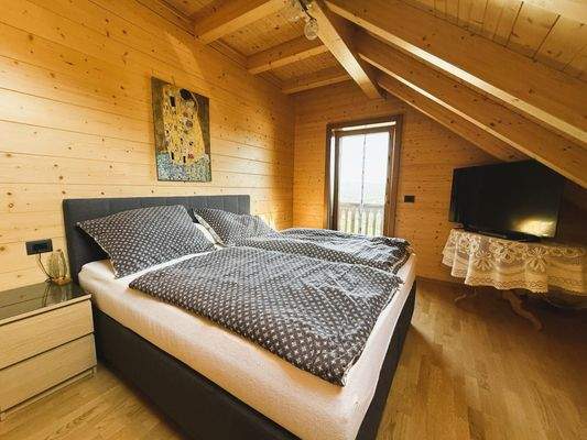 Schlafzimmer mit Balkon