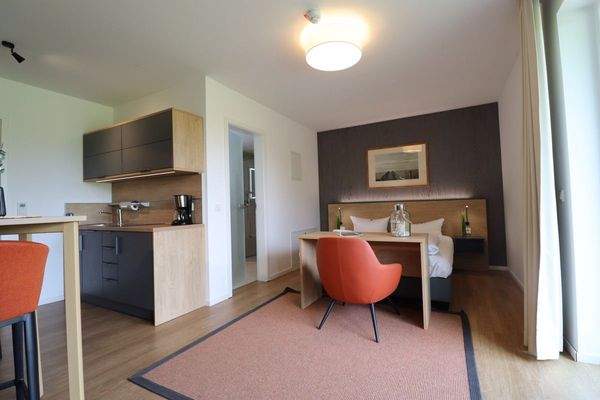 Schlafbereich mit offener Küche