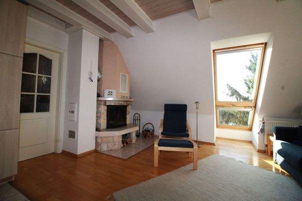 Kamin mit Dachbalkon