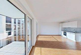 Ansicht I: Wohn- und Schlafzimmer mit offenem Küchenbereich