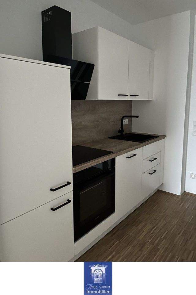 Dachtraum im Neubau mit Fußbodenheizung, großem Balkon, EBK, Lift! Erstbezug! - Photo 1
