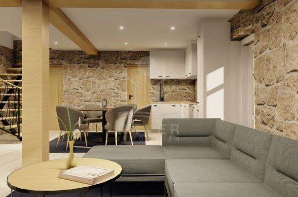 Ein zauberhafter Kamin schmückt den Wohnbereich