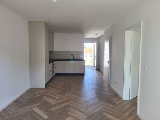 Wohnzimmer mit offener Wohnküche 