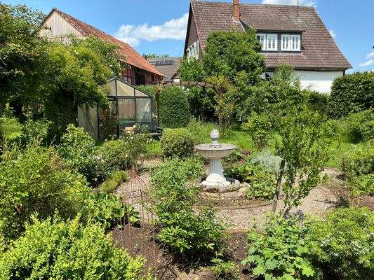 Ziergarten und Gewächshaus
