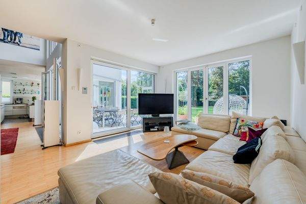 Living area with garden view and fireplace ambianc
