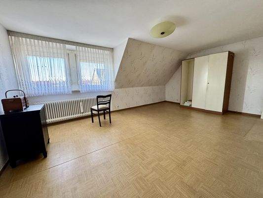 Schlafzimmer mit Gaube im Dachgeschoss