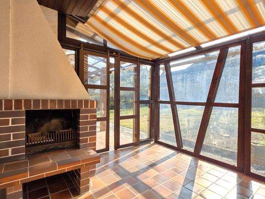 Wintergarten mit Kamin