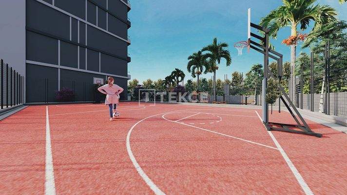 New Apartments in Mersin with a Pool and Modern Landscaping