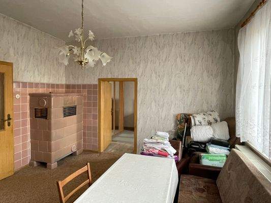 mit kuscheligem Kachelofen