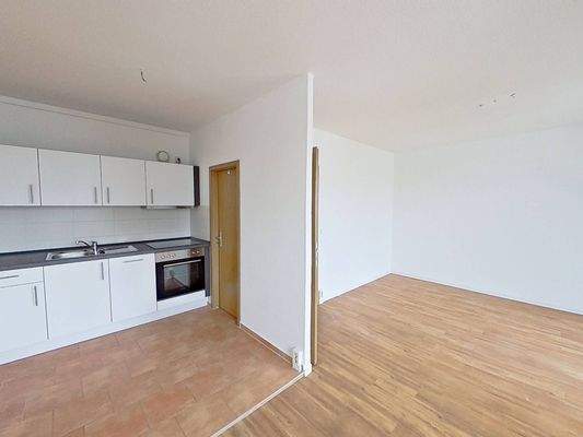 Ansicht IV: Wohn- und Esszimmer mit offenem Küchenbereich