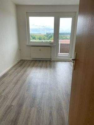 Wohnzimmer mit Balkon