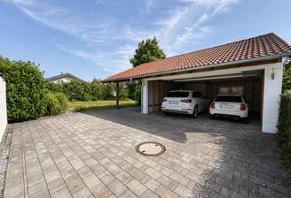 Doppelgarage mit Autos durch KI dargestellt