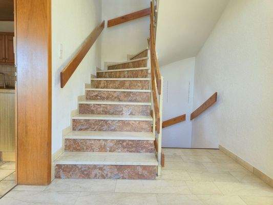 Ground floor: Stone staircase to the upper floor