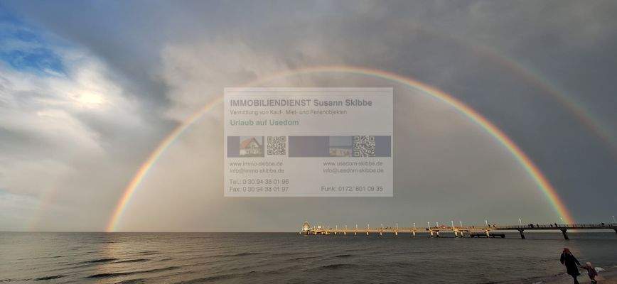 Seebrücke mit Regenbogen