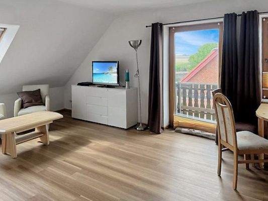 Wohnzimmer mit Balkonzugang Obergeschoss 